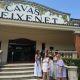 group of women outside a building with cavas Freixenet sign on top